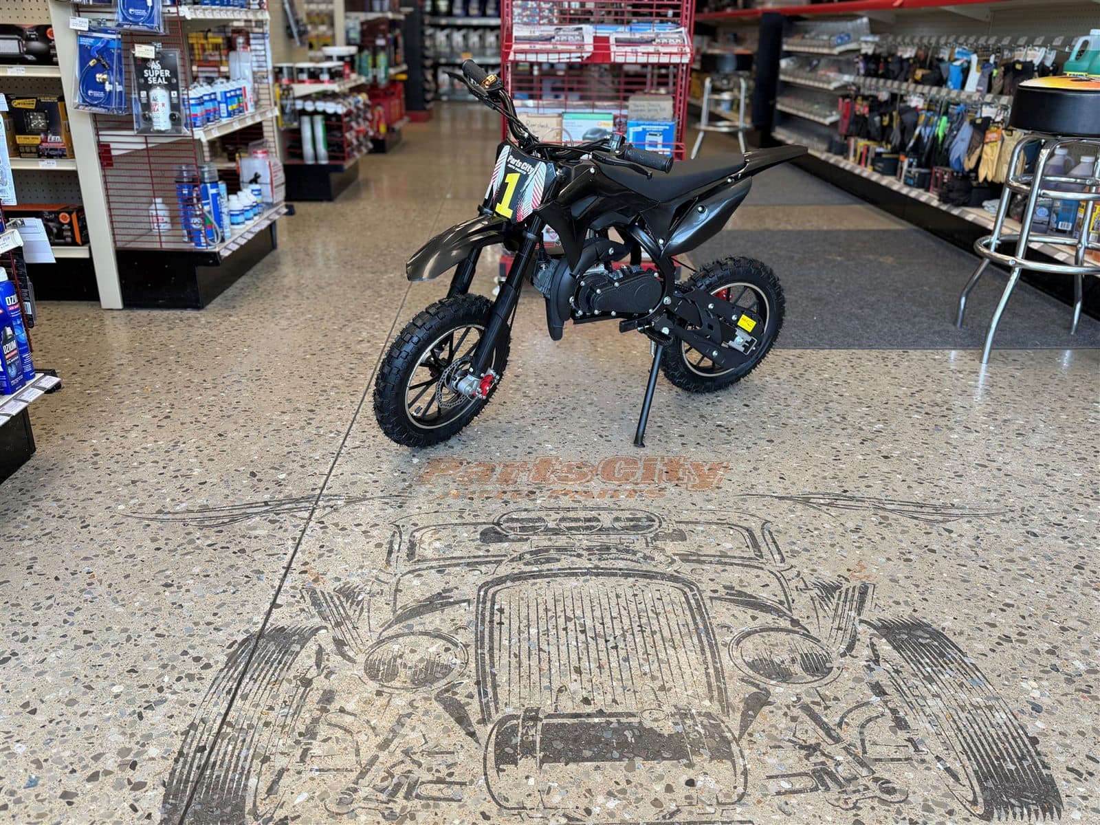 Parts City motorcycle giveaway prize displayed inside the store